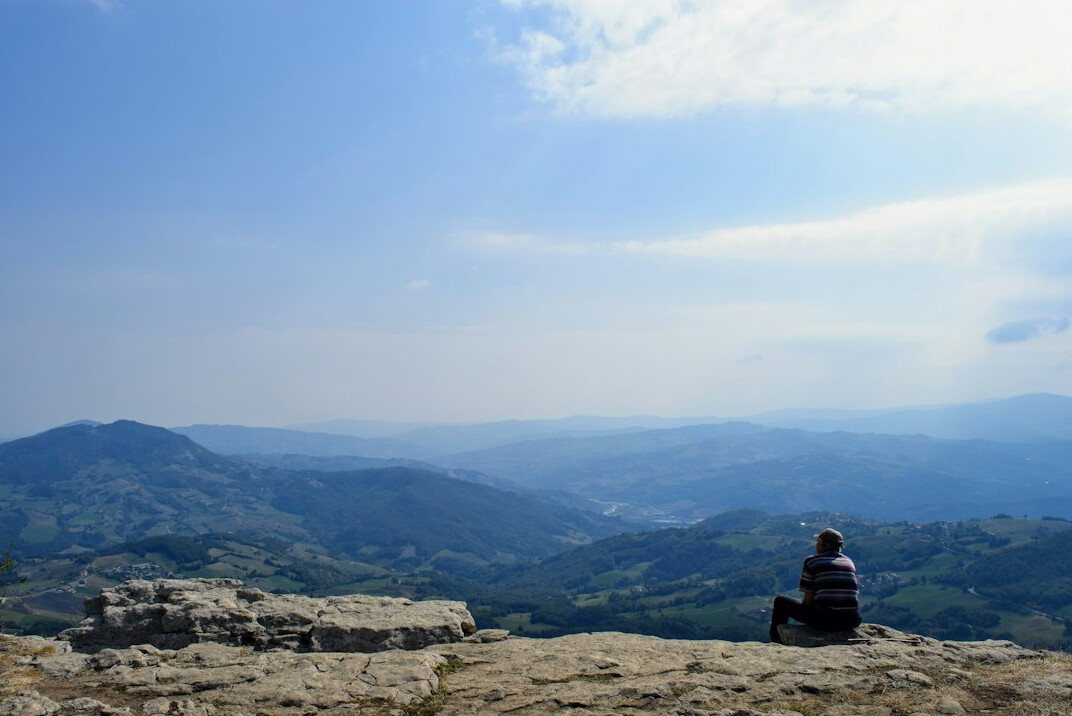 person meditating in nature